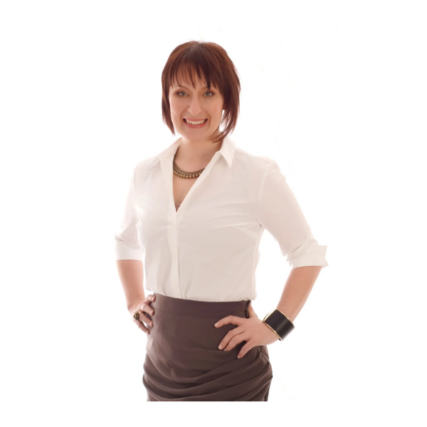 Dr. Rebecca Harwin smiling, hands on hips, in a white shirt
